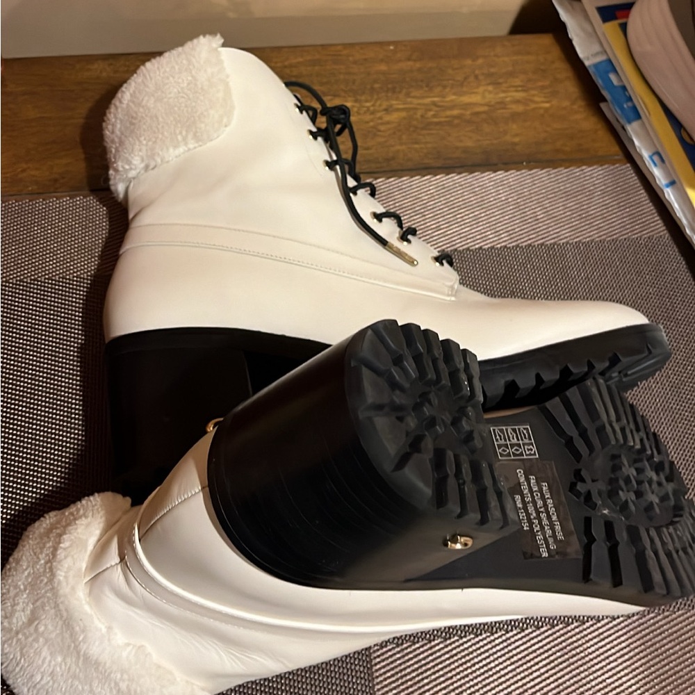 Leather white Coach boots with black soles